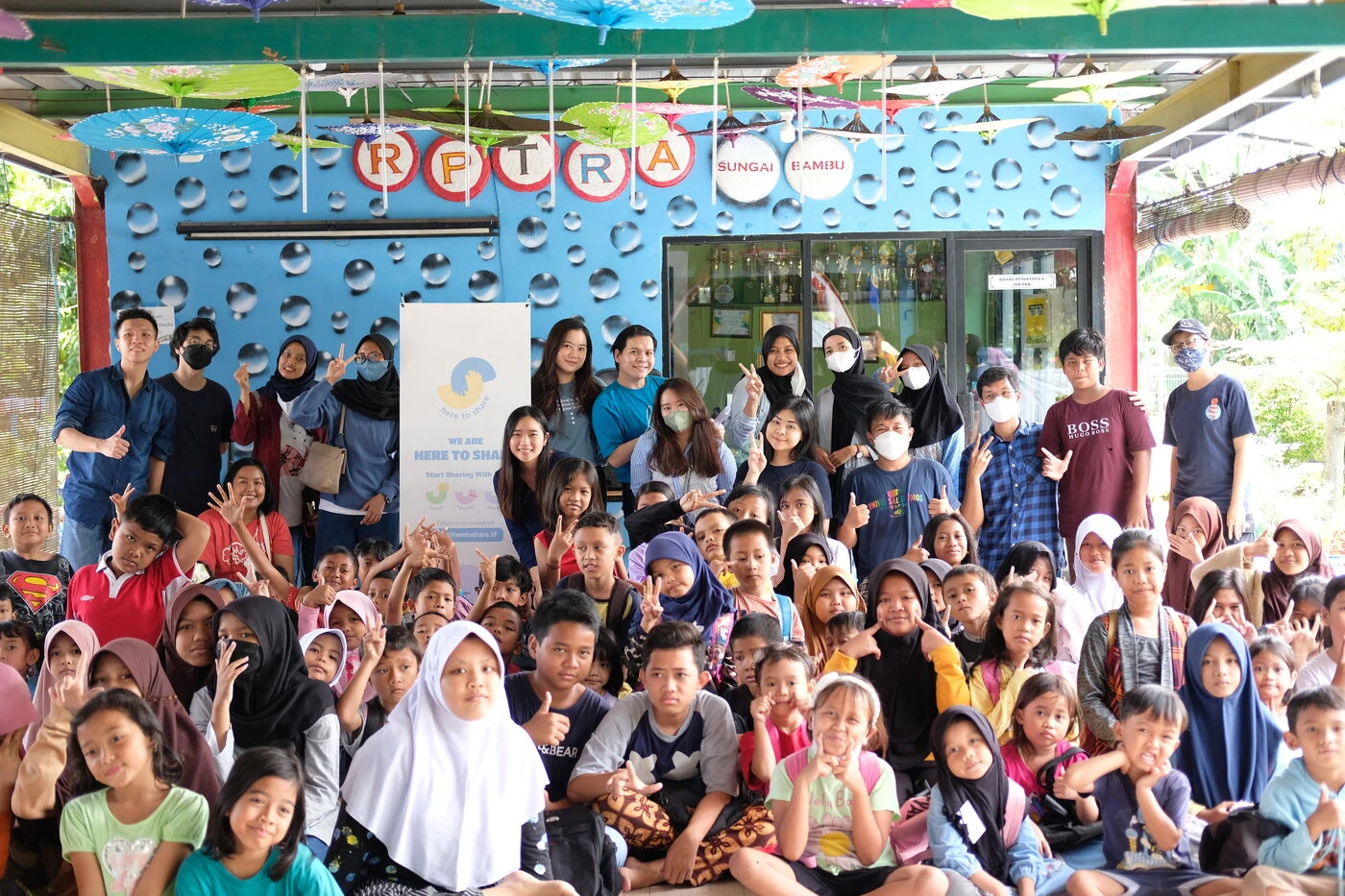 The Here to Share volunteer community together.
